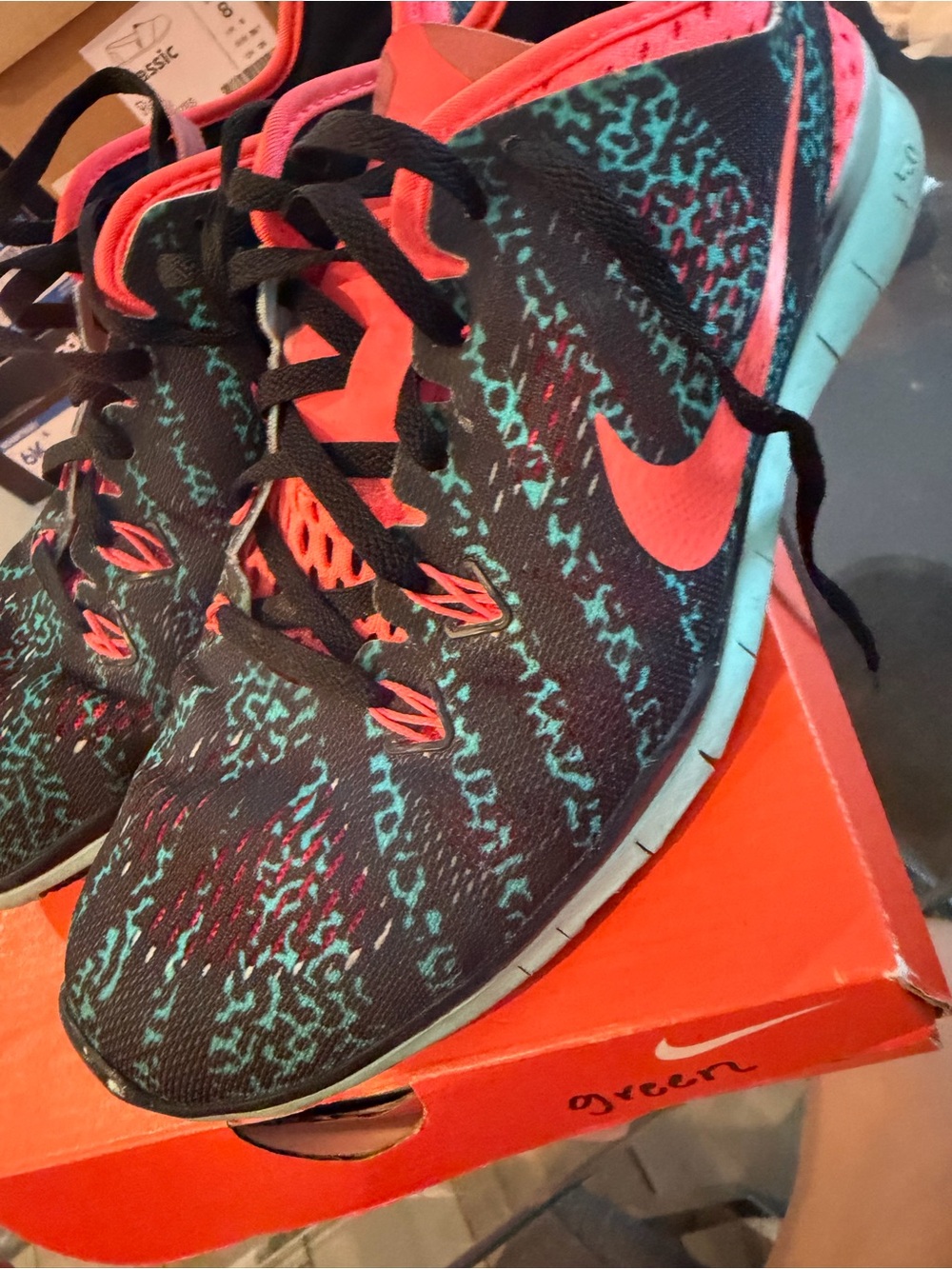 Nike Women's Black Running Shoes with Teal and Coral Details